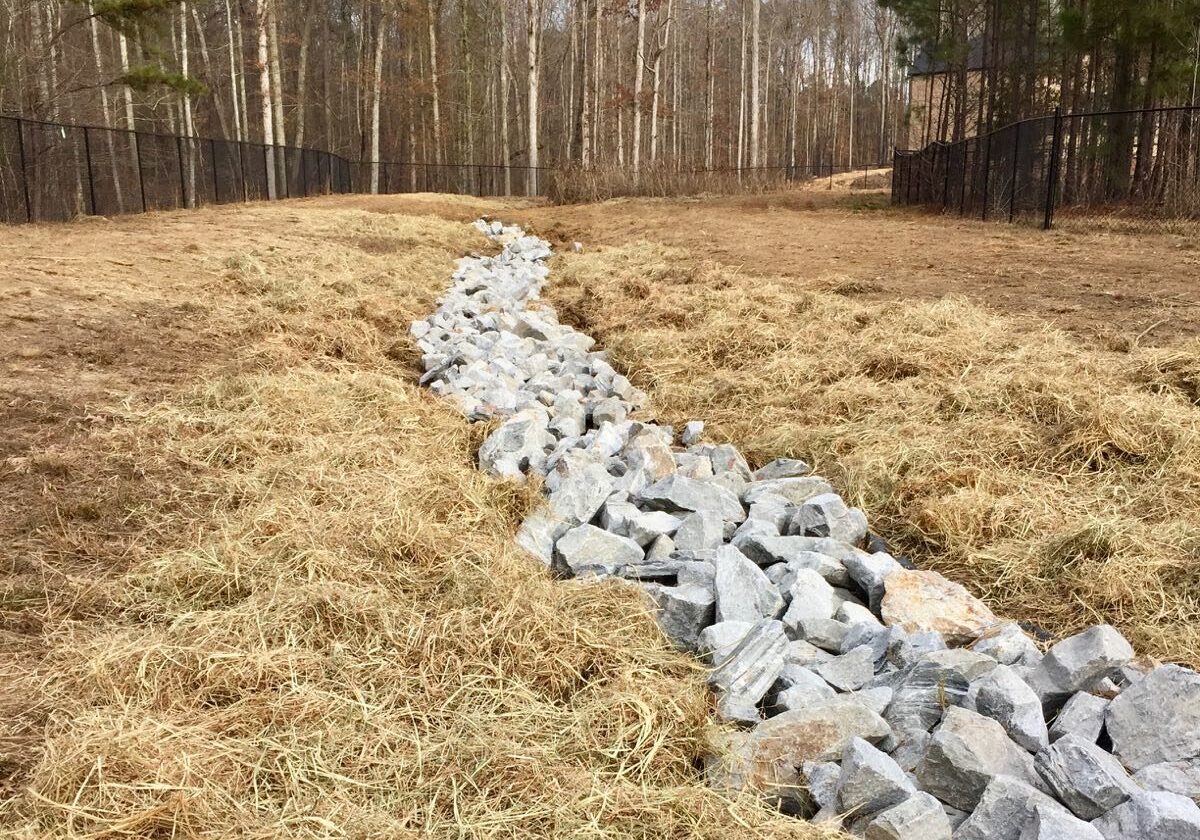 Retention pond stone refresh.